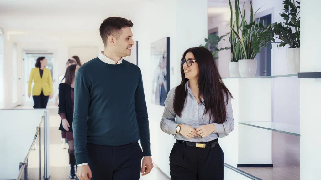 colleagues-talking-while-walking